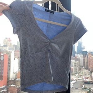 Light blue with flower design shirt